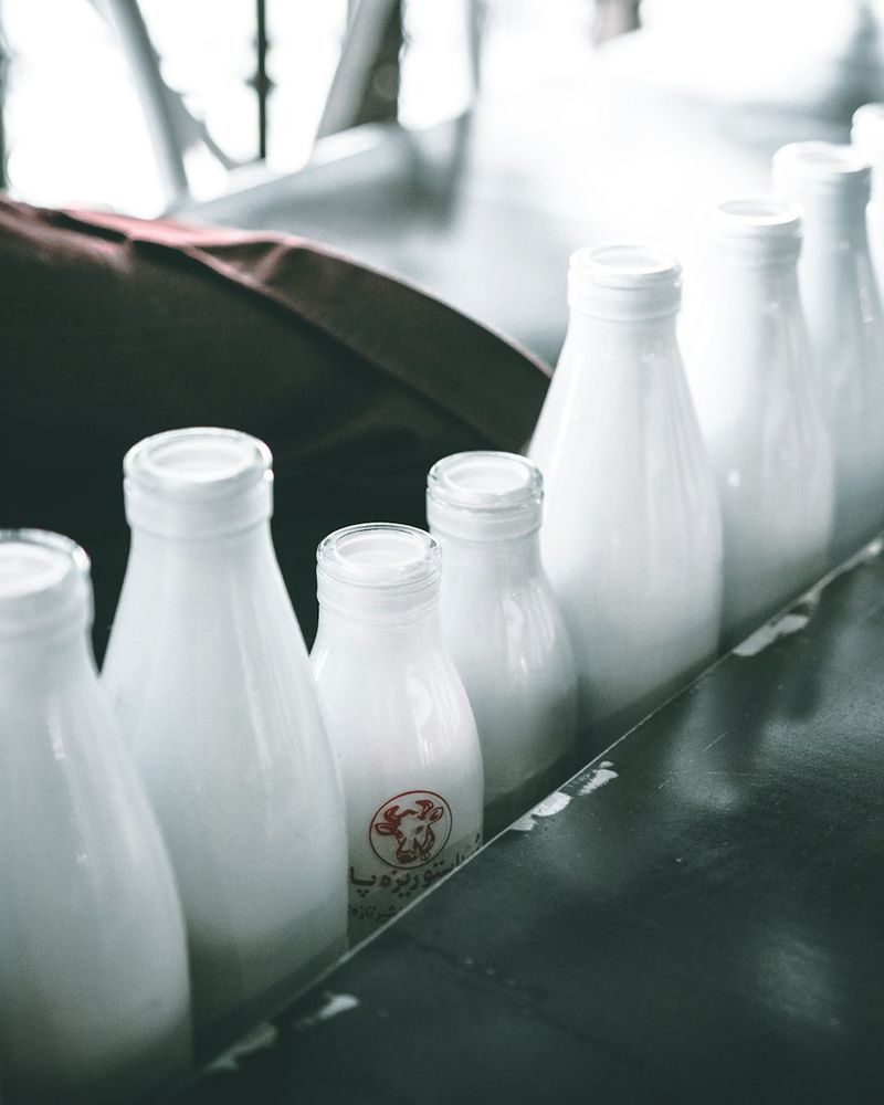 Glass bottles of fresh milk in a row
